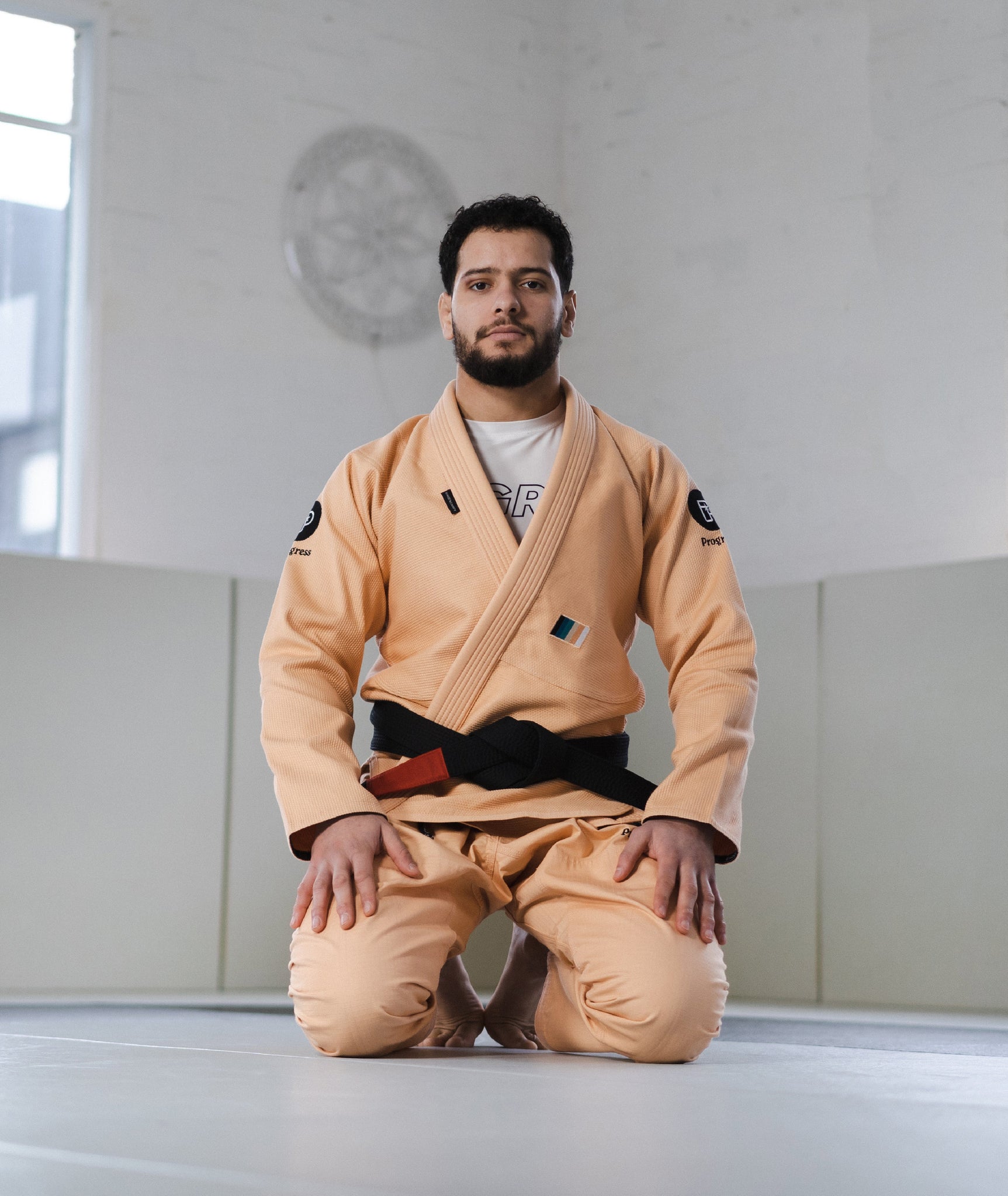 BJJ Black Belt Athlete wearing the M6 Mark 6 (Peach) Gi