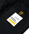 Progress brand patch on the black The Foundation Three Gi Pants