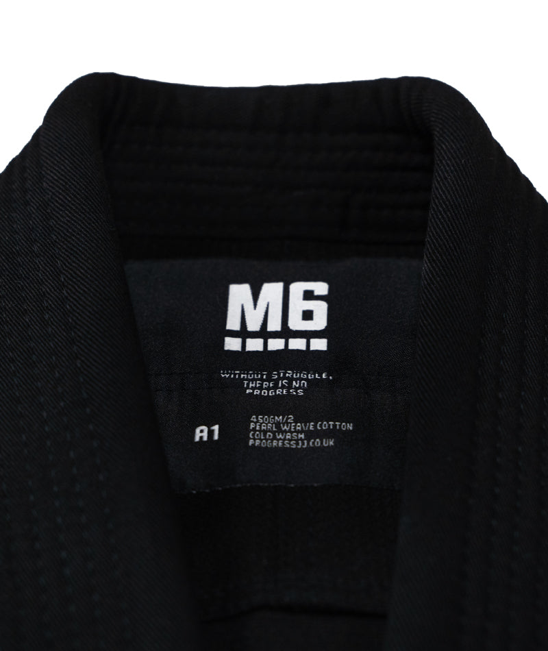 A close up of the Black M6 Kimono Mark 5 tag