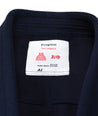 A close up image of the Navy blue The Temple Kimono tag containing the brand name and size.