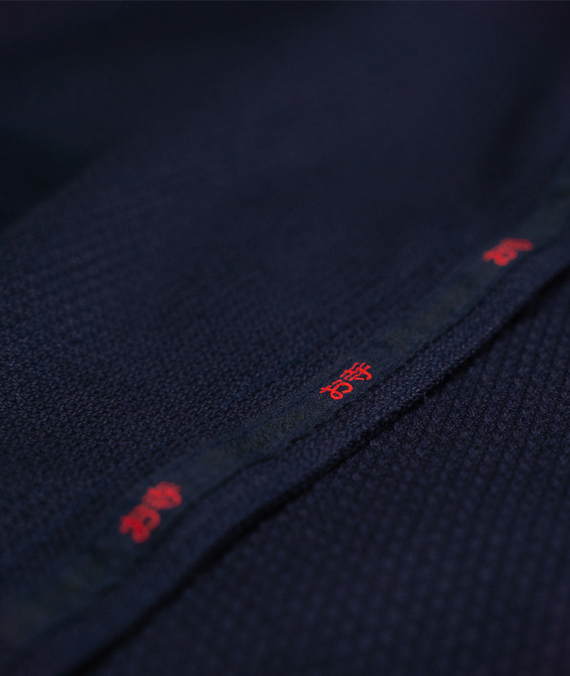 Close up view of the inner lining design of the navy blue The Temple Kimono