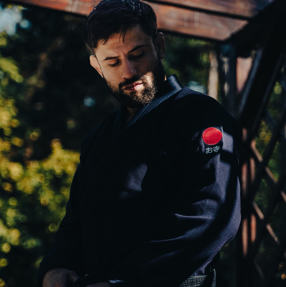BJJ Black Belt Marc Berman wearing The Temple Kimono - Navy