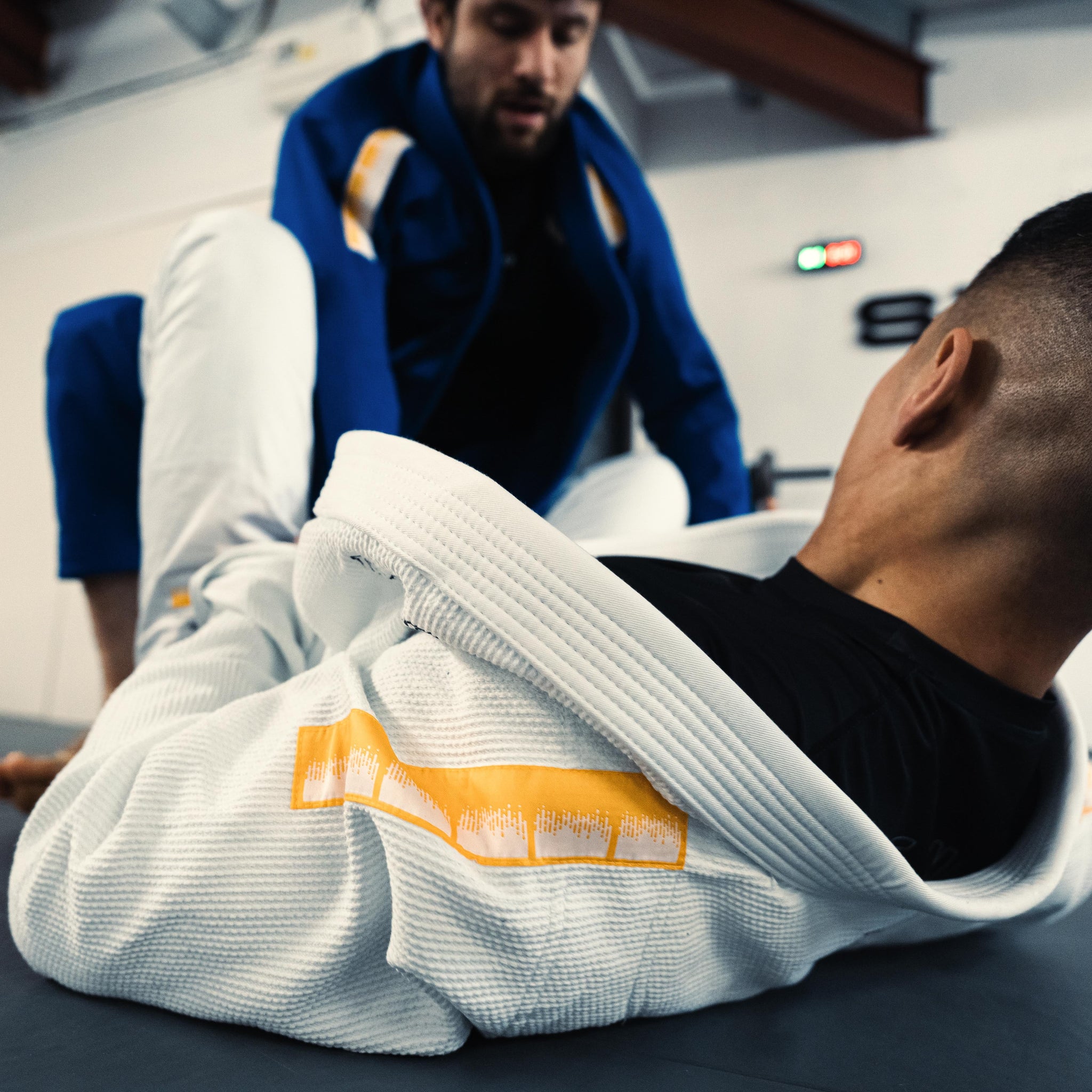 BJJ athlete using the white The Foundation Three during training